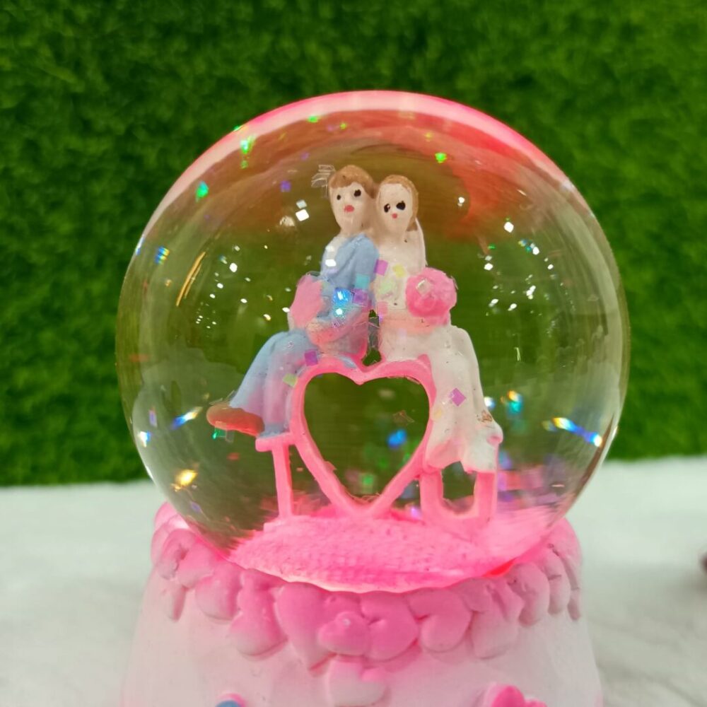 Snow Globe Couple with Colorful Lights and Music